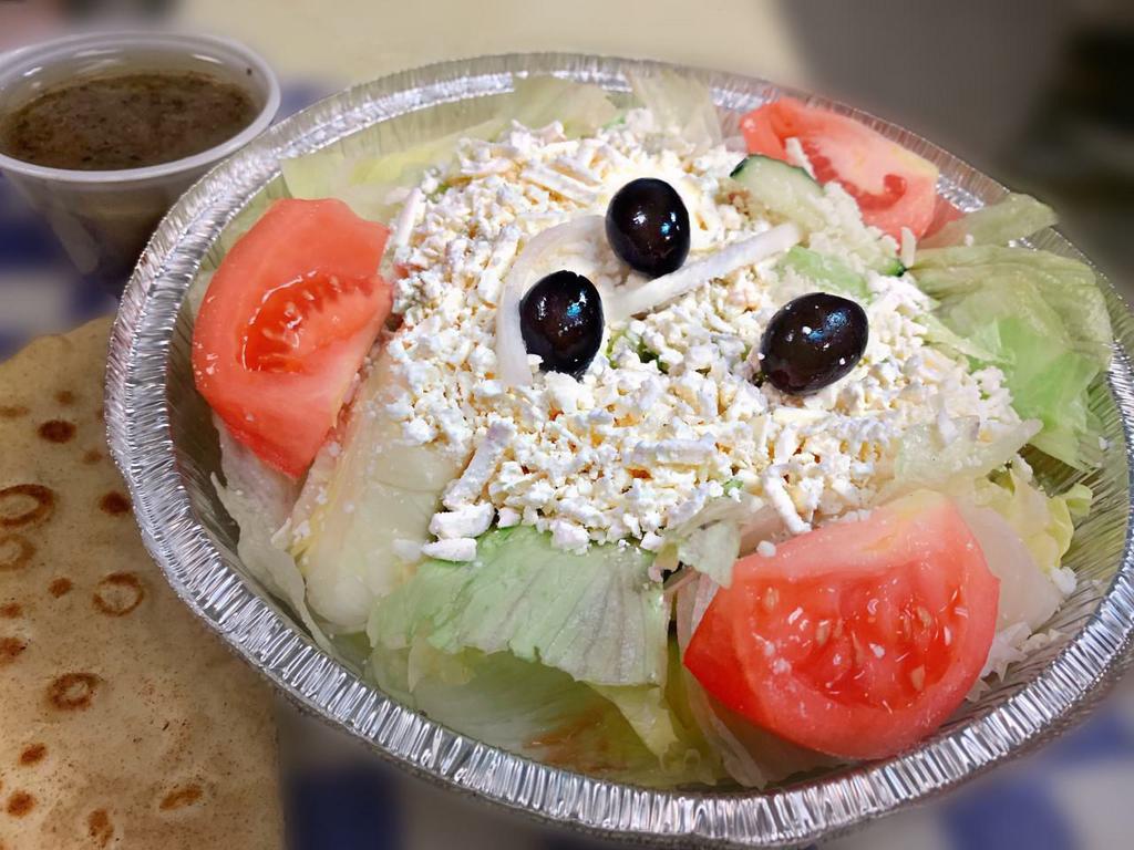 Greek Salad · Topped with feta cheese.