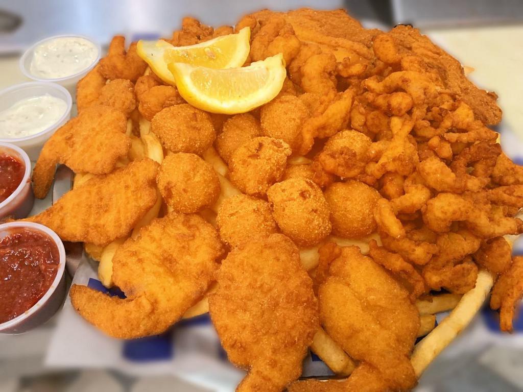 Seafood Platter · Serves 2 person .Comes with  New England clam strips, 6 large butterflied shrimp, 2 tilapia fish fillets and popcorn shrimp. Served with fries, hushpuppies,  2 homemade tartar sauce and 2 cocktail sauce 2oz cup.
