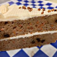 Carrot Cake · Gourmet carrot cake with layers of sweet and tangy cream cheese frosting.
