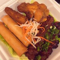 A8. Thap Cam · Thit heo nuong, goi cuon, cha gio and can ga chien. Sample plate with grilled pork, spring r...