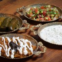 Combination Platter · A combination of Dolmeh, Kashk-e-Baademjoon (eggplant), Shirazi Salad and Maast-o-Khiar . 