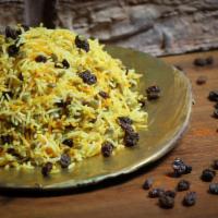 Addass Polo ·  Basmati rice cooked with saffron, lentils, and raisins.