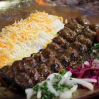 Koobedeh · One skewer mixed of fresh ground beef and ground lamb prepared with onion , herbs and spices...