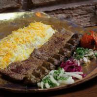 Lamb Soltani · A combination of a Lamb Kabob skewer and a Koobideh skewer (beef or chicken) , served with b...