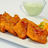Fish Pakora · Boneless fish marinated in lime, ginger-garlic paste and coated with gram flour batter and d...