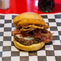 Smoke House Burger · Smoked bacon, onion rings, gourmet steak sauce, provolone cheese, Dijon mustard, and crispy ...