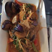34. Red Tilapia · Deep-fried whole tilapia fish with Japanese eggplant, basil, and bell pepper in red curry sa...