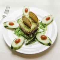 Tuna Tartare · Marinated tuna with avocado and seaweed salad.
