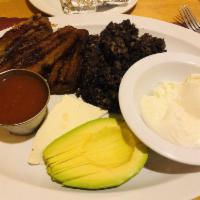 Huevos al Gusto · Eggs, mix of rice and black beans, fresh cheese, sour cream, salsa and choice of avocado or ...