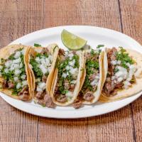 #21. Tacos Mexicanos · 5 Mexican tacos with onions and cilantro and hot salsa on the side. Your choice of meat.