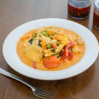 Island Curry · Prepared with coconut milk, pineapple, onions, pea and carrots, tomatoes, bell peppers and b...