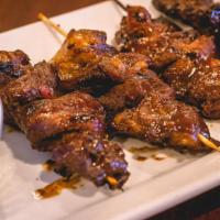 4 Piece Pork BBQ · Slices of pork marinated in our special BBQ sauce, speared in bamboo skewers and grilled to ...
