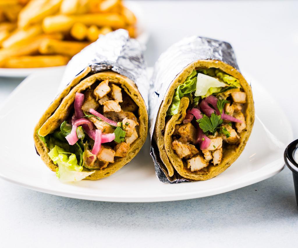 Chicken Shawarma Wrap · Yogurt and spice marinated chicken breast, green mix, pickled onion, and white sauce.