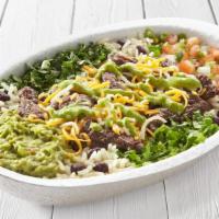 Fajita Beef Burrito Bowl · Fajita beef, lettuce, cilantro-lime rice, black beans, guacamole, pico de gallo, shredded ch...