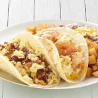 Breakfast Taco Plate · Your choice of 2 breakfast tacos. Served with Latin-fried potatoes and refried beans.