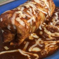 Wet Burrito · Beans, rice and choice of meat smother with spicy green sauce or mild red sauce. Topped with...