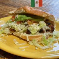 Torta Plate · Mexican sandwich. fresh tellara bread with your choice of meat, refried beans, lettuce, chee...