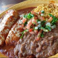 Tamale Plate · 2 freshly made tamales stuffed with chicken or pork, covered in mild or spicy salsa and chee...