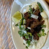 Taco Pequeno · Choice of meat with cilantro and onions.