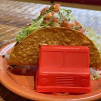 Hard taco · Crispy fried corn tortilla with meat topped with lettuce and pico de Gallo 