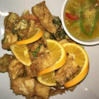 113. Orange Sesame Chicken · Deep fried chicken, then stir-fried with orange sauce, bell pepper, pineapple, topped with g...