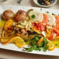 Bacalhau a Lagareiro · Grilled codfish in garlic, oil, and roasted peppers.