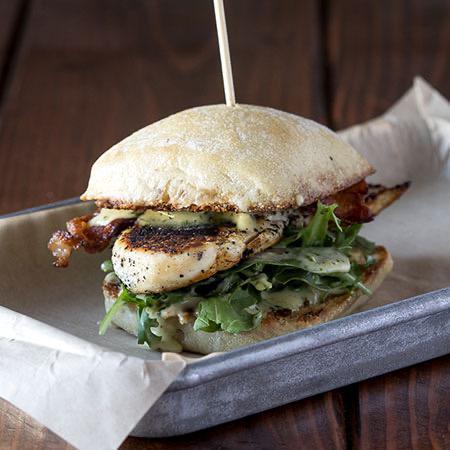 Morrison Burger · Herb-marinated chicken, bacon, pesto, baby arugula, aioli, on ciabatta.
