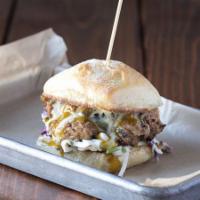 Burlington Burger  · Pecan-smoked pork, Carolina mustard BBQ sauce, creamy slaw, aioli, on ciabatta.

