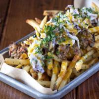Loaded Burlington Fries · PDX truffle fries with pecan-smoked pork, Carolina mustard BBQ sauce, creamy slaw, and parsl...