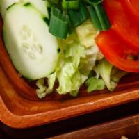 House Salad · Freshly cut tomatoes, lettuce, cucumbers, carrots served with our home made house dressing.