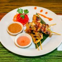 Chicken Sate · Marinated and grilled chicken, peanut-reduction and sweet and tangy dipping sauce.