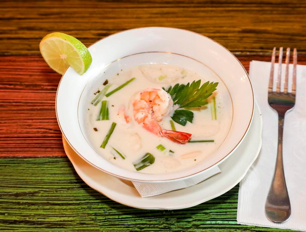 Tom Ka · Coconut lemongrass soup. A rich, smooth coconut based soup with import coconut milk, roasted chilies, kaffir lime leaf, fresh lime juice, mushrooms, green onions and Thai spices.