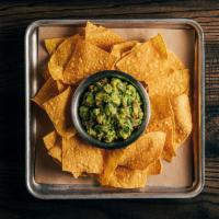 Tortilla Chips with Housemade Guacamole · Thinly sliced and crispy. 