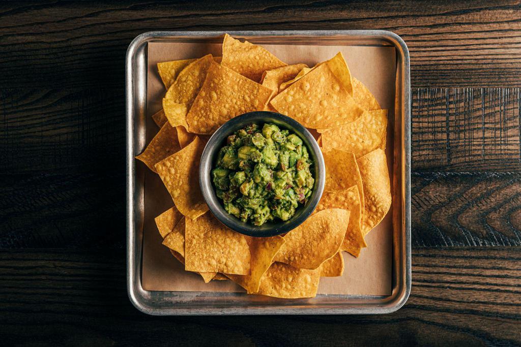 Tortilla Chips with House-made Guacamole · A creamy dip made from avocado.