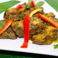 Karaikudi Pepper Chicken · Chunks of chicken cooked with crushed pepper corn flavored with authentic spices.