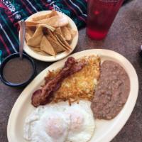 1. Almuerzo al Gusto Plate · 2 over easy or scrambled eggs served with hash browns, beans and choice of bacon, sausage, h...