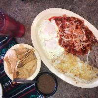 9. Almuerzo con Chilaquiles Plate · 2 over easy eggs, red chilaquiles, served with hash browns, beans and choice bacon, sausage,...