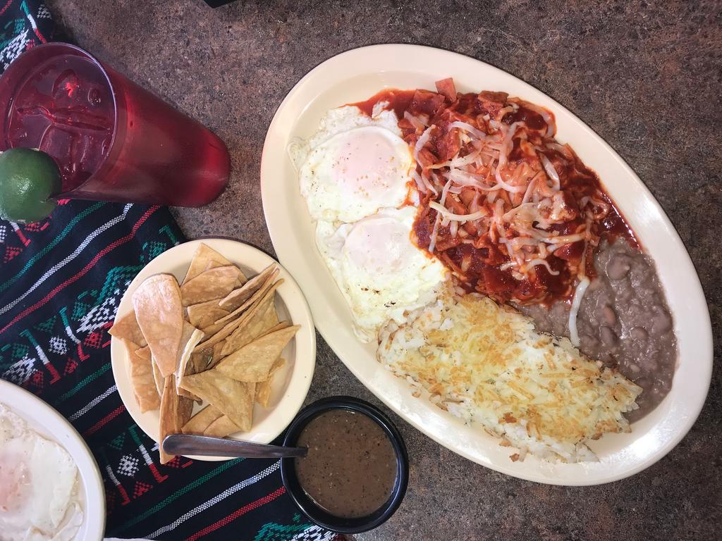 9. Almuerzo con Chilaquiles Plate · 2 over easy eggs, red chilaquiles, served with hash browns, beans and choice bacon, sausage, ham or winnie.