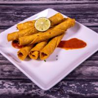 17. Flautas Plate · 6 beef or chicken flautas served with rice, beans and salad with a side of sour cream and gu...