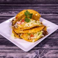 26. Tacos Deshebrada · 3 crunchy shredded beef tacos with fresh lettuce, tomatoes and shredded cheese served  with ...