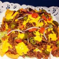 Nachos Supreme · Served with steak, red onions, fresh tomatoes, lettuce, jalapeno, cheddar and sour cream. Ho...