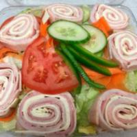 Antipasto Salad · Garden salad with salami, hot ham, mortadella and provolone. Served with pita bread and your...