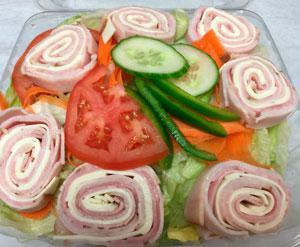 Antipasto Salad · Garden salad with salami, hot ham, mortadella and provolone. Served with pita bread and your choice of dressing.