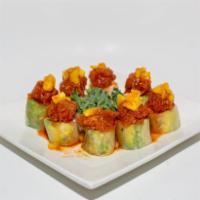 Rose Roll · Inside: shrimp tempura, crabmeat and avocado. Outside: special tuna and pineapple, wrapt wit...