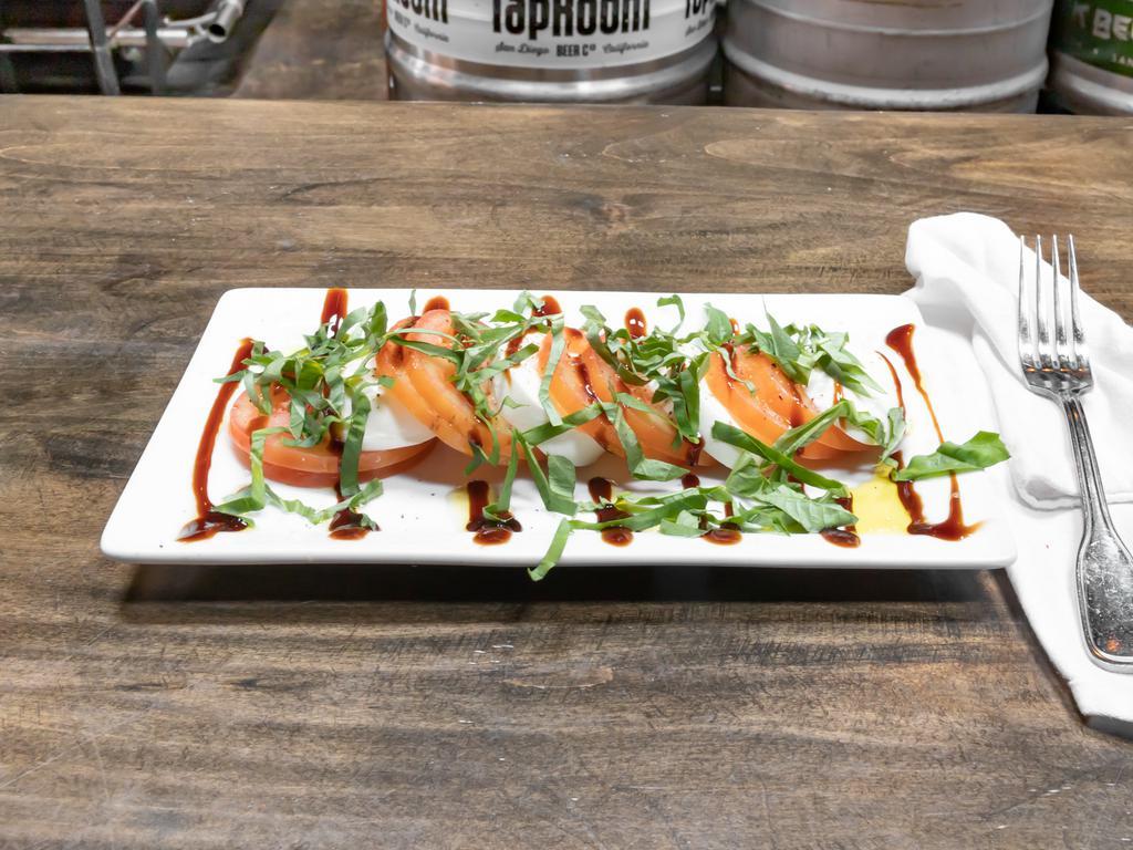 Caprese Salad · Fresh mozzarella, tomatoes, fresh basil, drizzled with balsamic reduction glaze and extra virgin olive oil.
