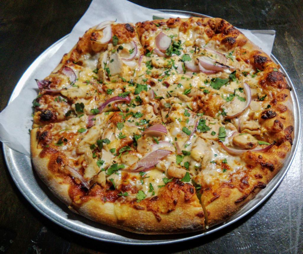 BBQ Chicken Pizza · Grilled chicken, red onions, Gouda, BBQ sauce, mozzarella and cilantro.