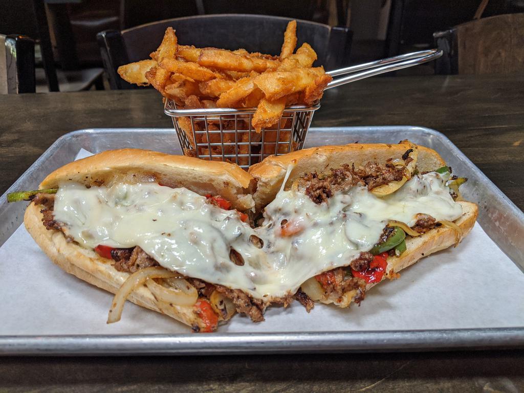 Philly Sub · Sliced ribeye, sauteed onions, bell peppers and provolone.
