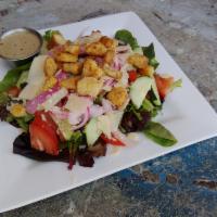 Mixed Green Salad · Tomatoes, cucumbers, pickled onions, croutons, Parmesan and choice of dressing.