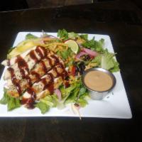 BBQ Chicken Salad · Grilled free range chicken glazed with hickory BBQ sauce, Romaine, black beans, cheddar, cor...