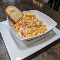 Lobster Mac and Cheese · Sauteed garlic, lobster, chopped tomatoes, brandy cream sauce and cheese topped with bread c...